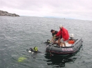 Expedition Divemasters Harry Dort and Terry Dwyer assist in picking up two divers after a long decompression dive.