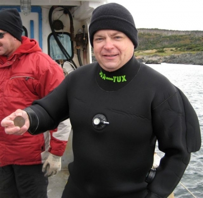 Terry Dwyer with a Mexican Silver Pillar Dollar recovered off St. Paul Island.