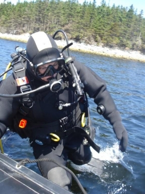 The Wreck Hunter demonstrates the proper technique to re-board a zodiac during the annual Canada Day Scallop Dive in Liscomb, Nova Scotia.