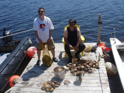 The Wreck Hunter – Terry Dwyer and the Salt Water Cowboy – Tim Spears With the spoils from the annual Canada Day Scallop Dive in Liscomb, NS.