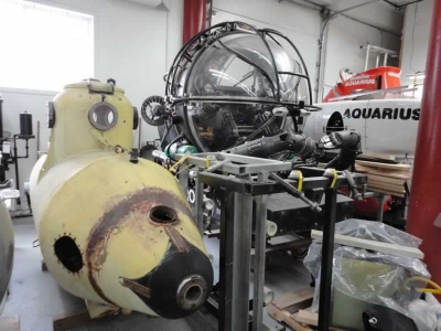 A partially restored 1-man submarine, the DEEP ROVER one atmospheric submersible and the AQUARIUS submersible.