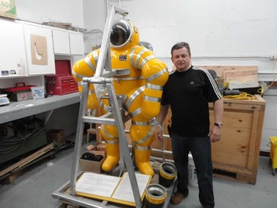 Terry Dwyer standing next to the original NEWTSUIT, Number 01 build in 1990.