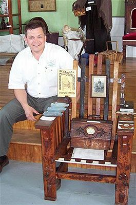 The author with the famous WRECK WOOD CHAIR located in the Chapel Hill Museum in Shag Harbour. There are only 3 of these chairs in the world, the second chair is on display at the Archelaus Smith Museum on Cape Sable Island. The third chair is in the private collection of Doug Shand in Shag Harbour.