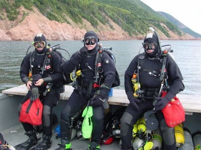 From left to right, Sam Millett, Steve Dugas and Terry Dwyer prepare for a wreck dive near Cape North, Cape Breton Island.