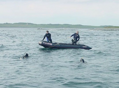 Ron Newcombe and Harvey Morash supervise divers from Harvey's Zodiac off Hay Island, Scatarie Island.