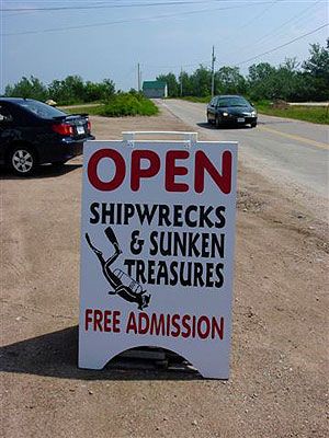 The sign out in front of the Wreck Hunter shipwreck Museum in Dingwall.