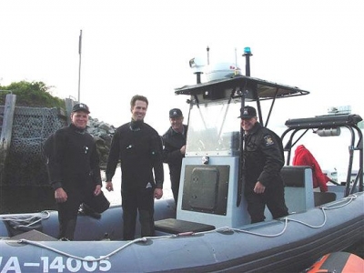 Safety Divers Sam Millett and Blair Christian with two RCMP Officers on the set of the feature film - The Shipping News, starring Kevin Spacey.